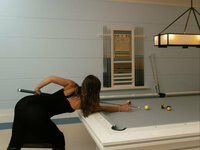 mika is playing billiards photo 1