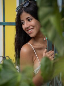 Pretty Latina with a leg tattoo Iris Lucky presents her big tits & masturbates photo 2