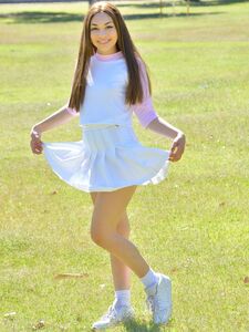 Brunette cutie Kelly reveals her tiny tits and fingers her snatch in the park photo 10