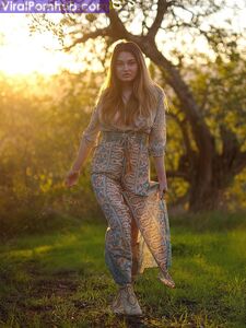 Solo model Gabriella Knight shows some tits and ass by an old outbuilding photo 3