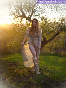 Solo model Gabriella Knight shows some tits and ass by an old outbuilding photo 4