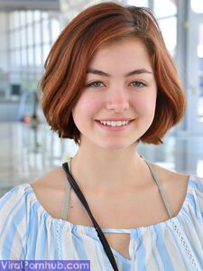 Cute redhead strips naked outdoors to spread pussy wide in the sunshine photo 2