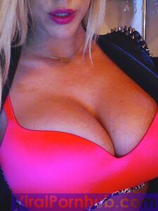 Smiling Blonde Chick Xo Gisele Is Playing With Her Enormous Boobs Before The Camera photo 6