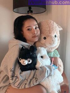 Bella Poarch Hugging her alpacas photo 1