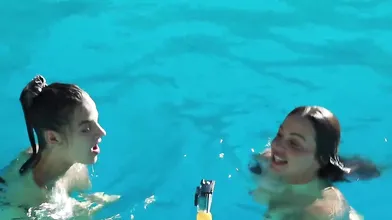 Abigail Mac Touching In A Pool With Her Friend
