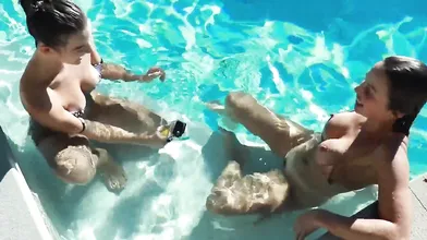 Abigail Mac Touching In A Pool With Her Friend