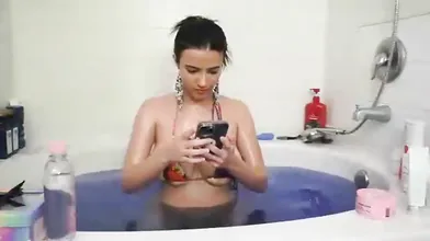 Strawberrytabby Sits In A Bathtub