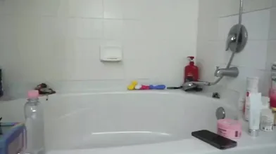 Strawberrytabby Sits In A Bathtub