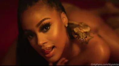 Kiyomileslie Poses Seductively With A Snake